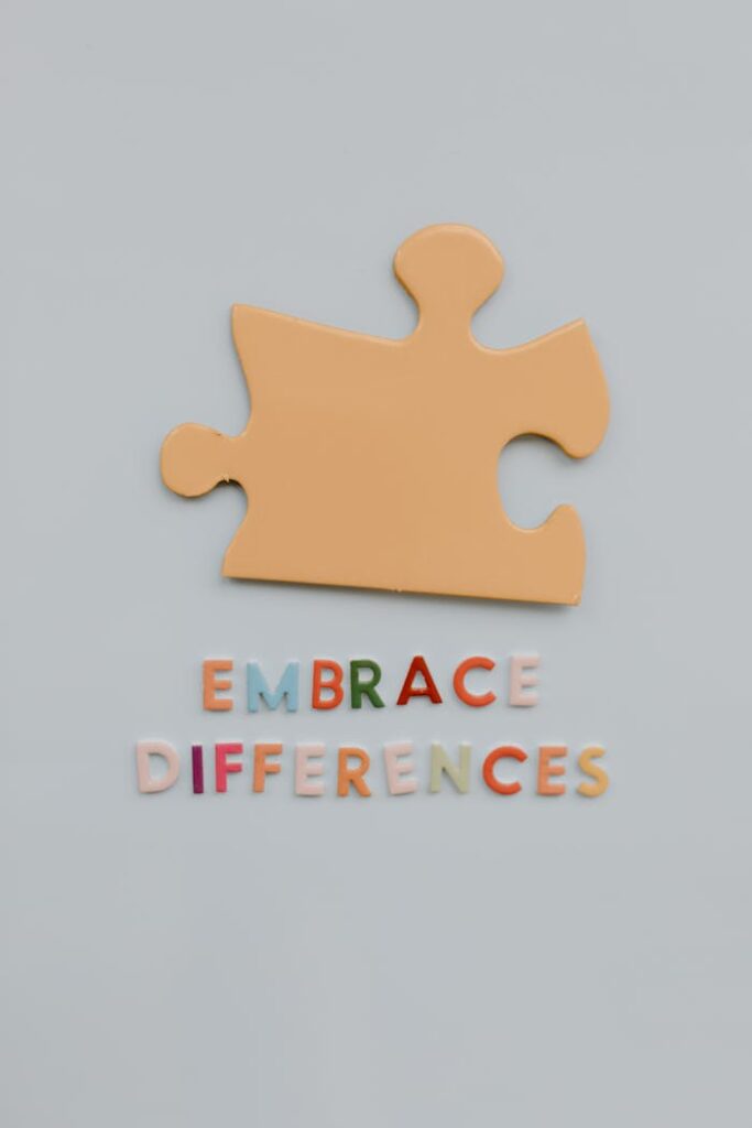 Colorful puzzle piece with text promoting autism awareness and embracing differences.